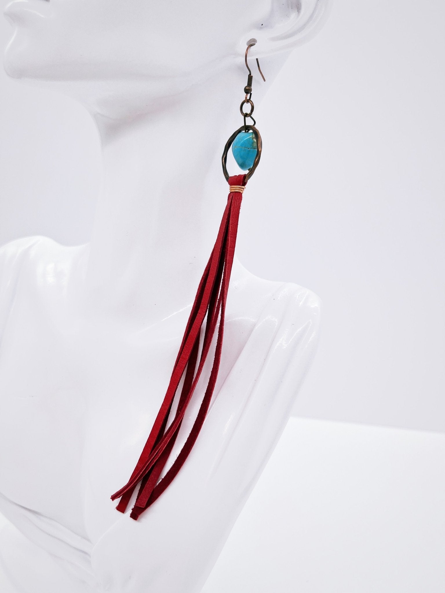 Turquoise Drop Earrings with Red Leather Tassel on mannequin display