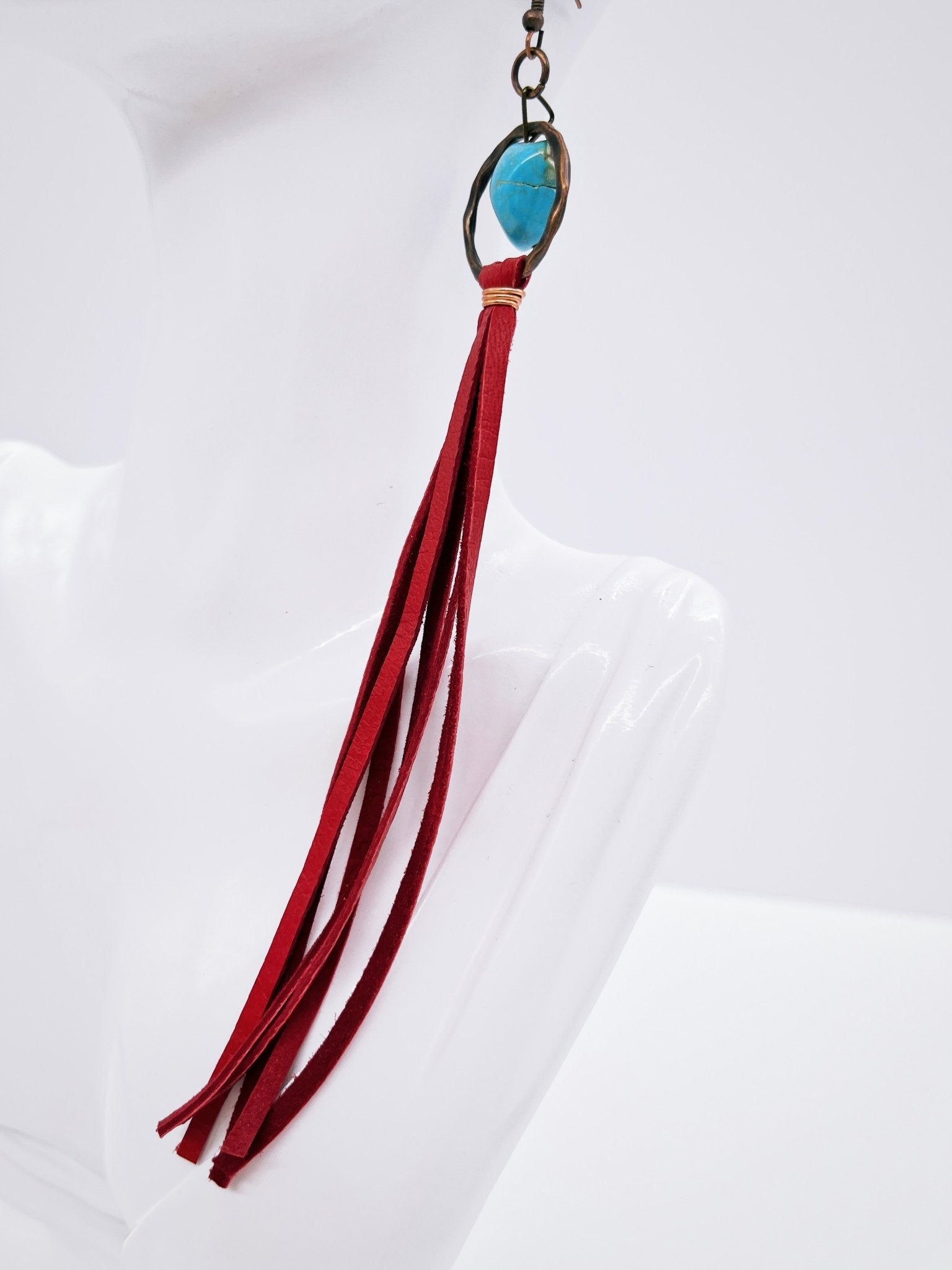 Turquoise Drop Earrings with Red Leather Tassel on mannequin display