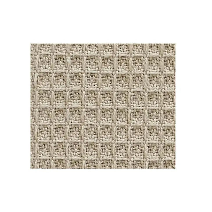 a close up of a beige woven fabric