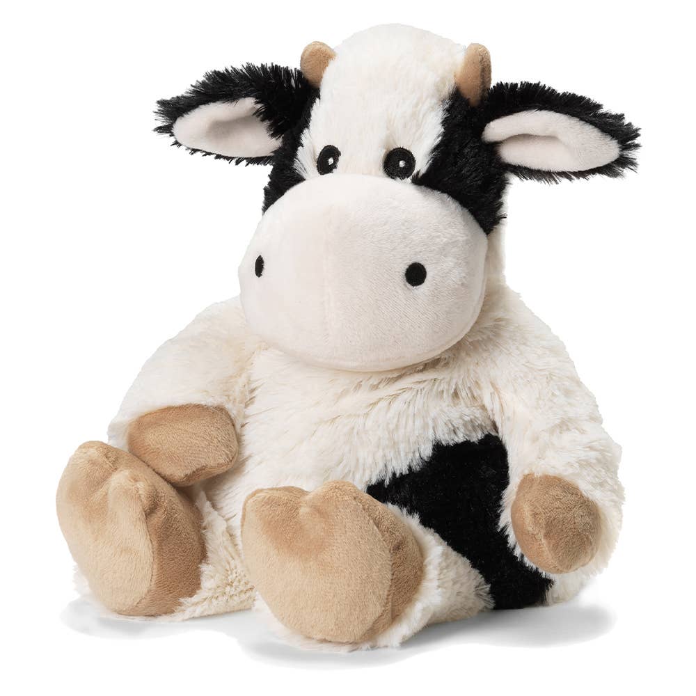 a black and white stuffed cow