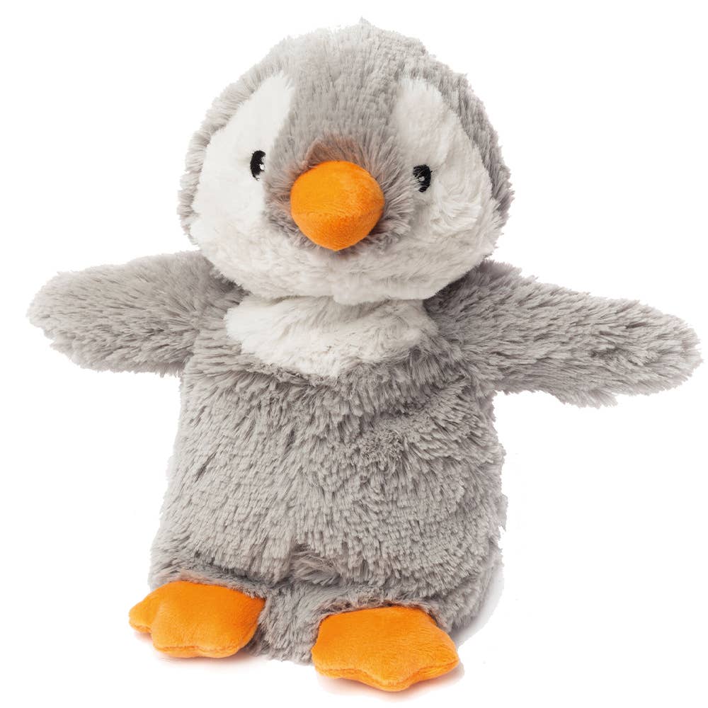 a stuffed penguin with an orange beak