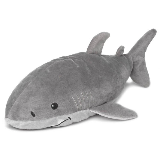 a stuffed shark is laying on the ground