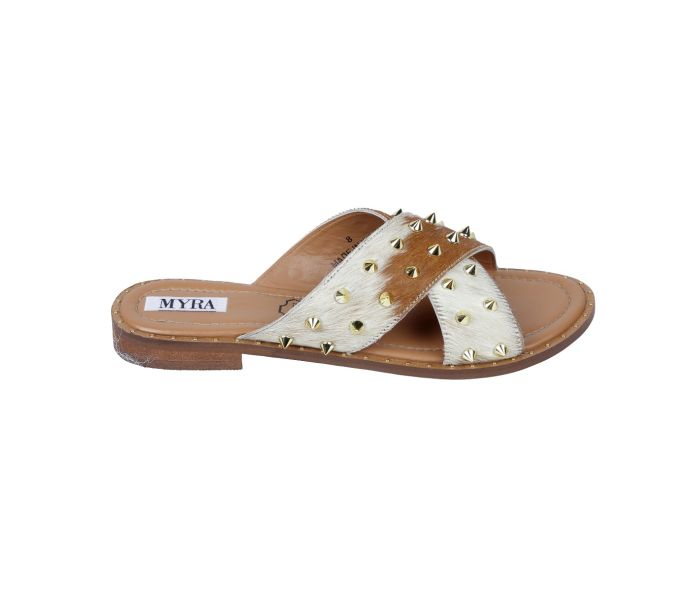 a pair of white and brown sandals with studded straps