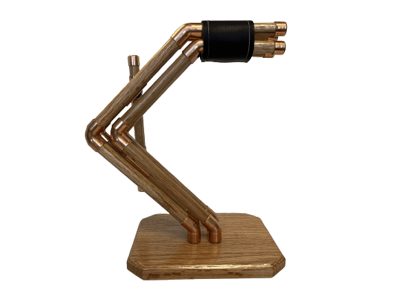 a headphone stand made out of copper pipes and wood