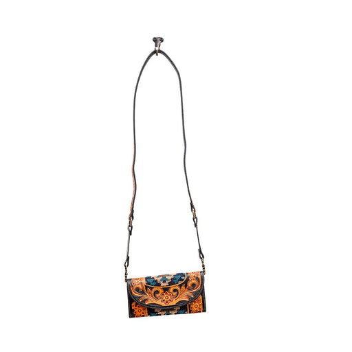 a purse with a long strap hanging from it