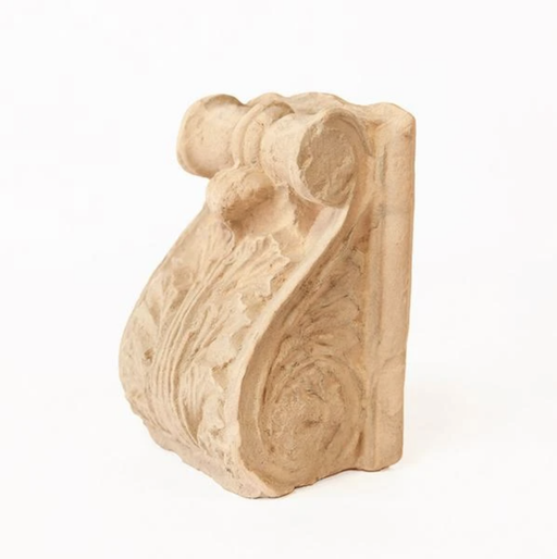a carved wooden object on a white background
