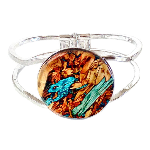 a close up of a bracelet with a colorful tumbleweed design on it