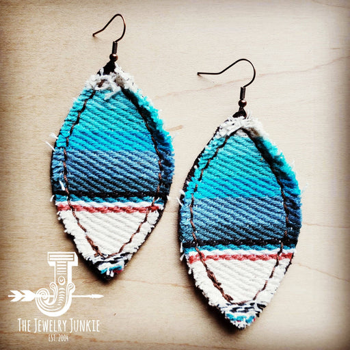 a pair of vibrant blue and white tear shaped serape earrings