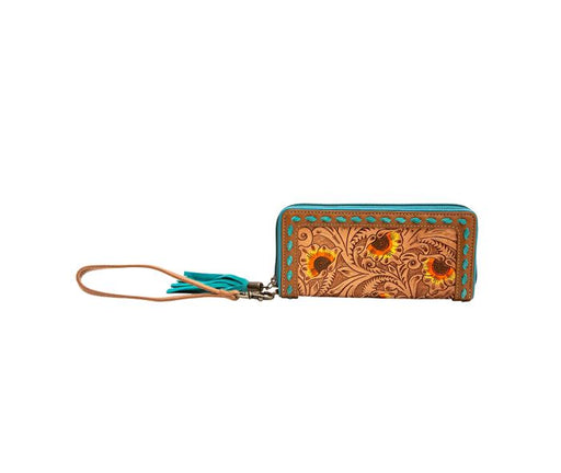 a wallet with a tassel hanging from it