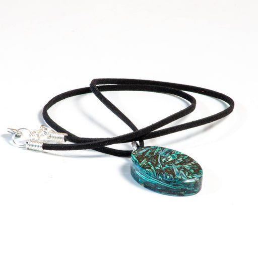a necklace with a bluish green pendant made of tumbleweed on a black cord