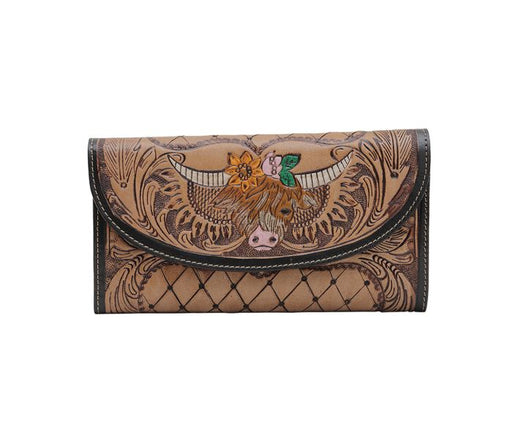 a women's wallet with a cow on it