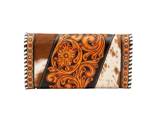 a brown and white cowhide wallet with a pattern on it
