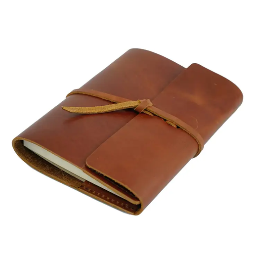 a brown leather journal with a yellow ribbon