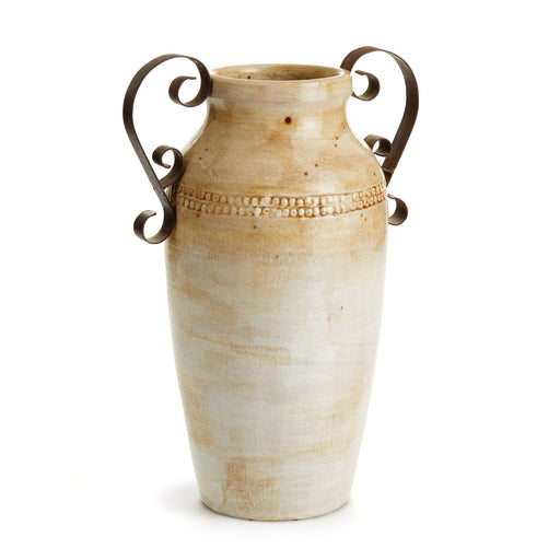 a ceramic vase with a metal handle on a white background