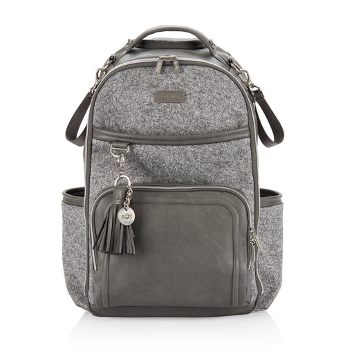 a gray backpack with a tassel hanging from the front