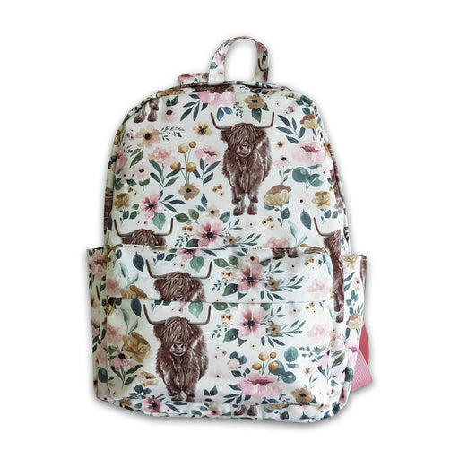 a floral backpack with a brown dog on it