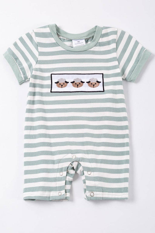 a green and white striped romper with three sheep on it