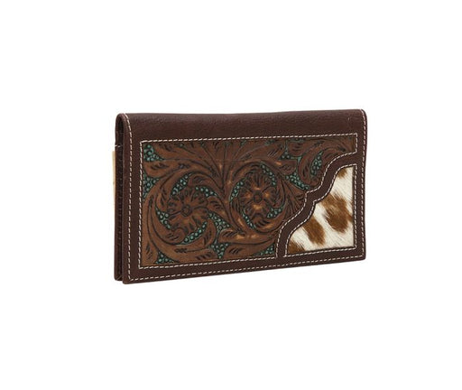 a brown wallet with a cow print design