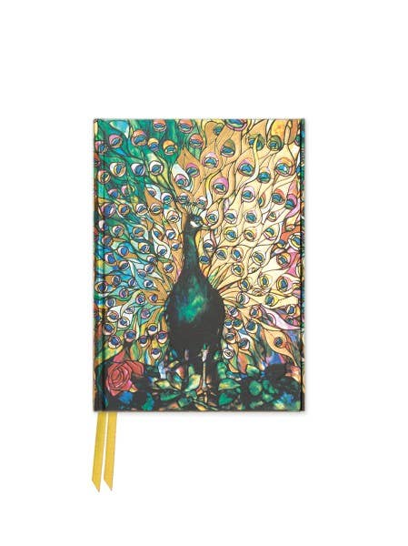a notebook with a peacock on the cover