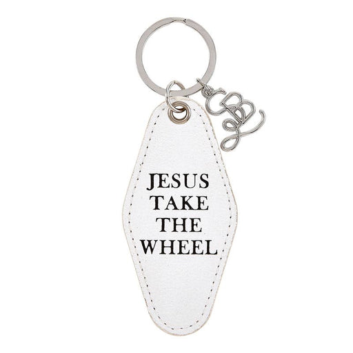 a white leather keychain with jesus take the wheel written on it